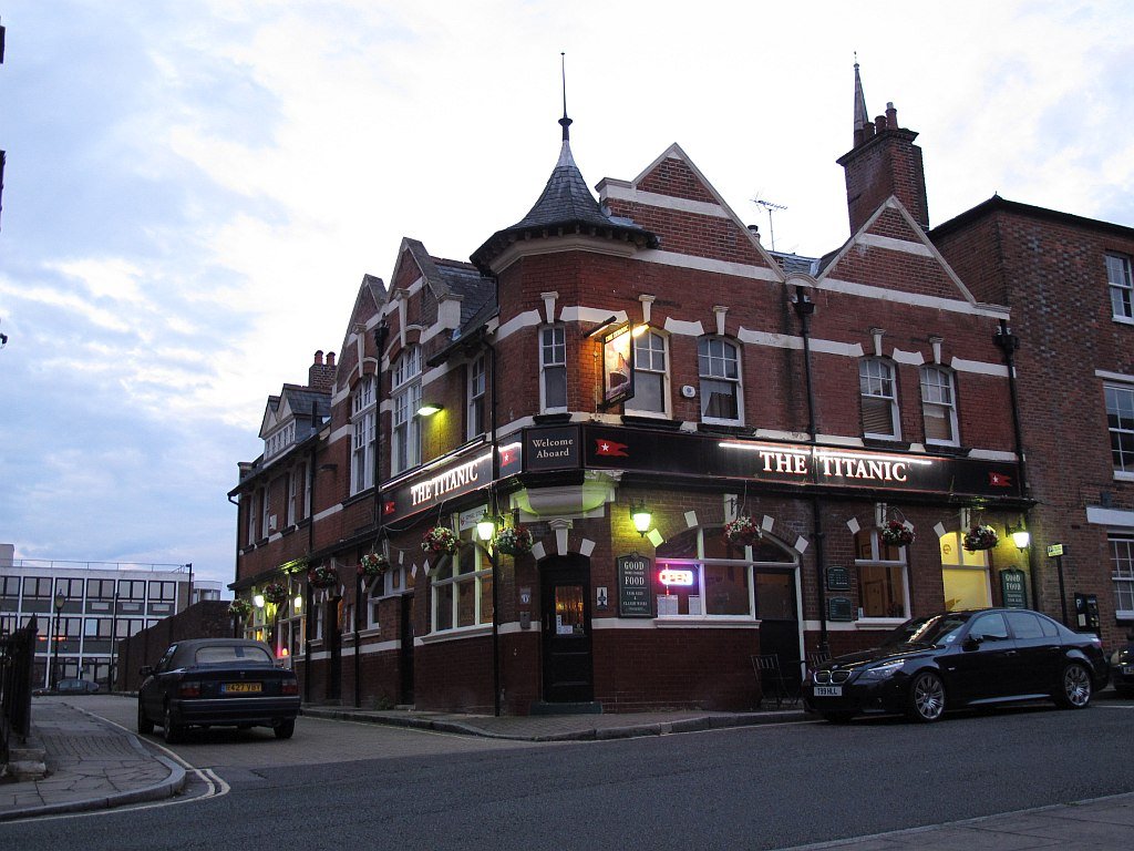 The Titanic pub on Simnel Street, lit up at dusk